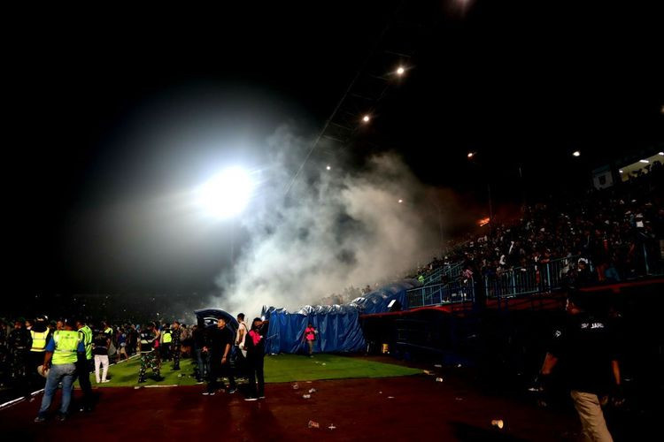 A cloud of tear gas rises over the stands at Kanjuruhan Stadium in Malang, East Java, after the match between home team Arema FC and rival Persebaya Surabaya on Oct. 1.